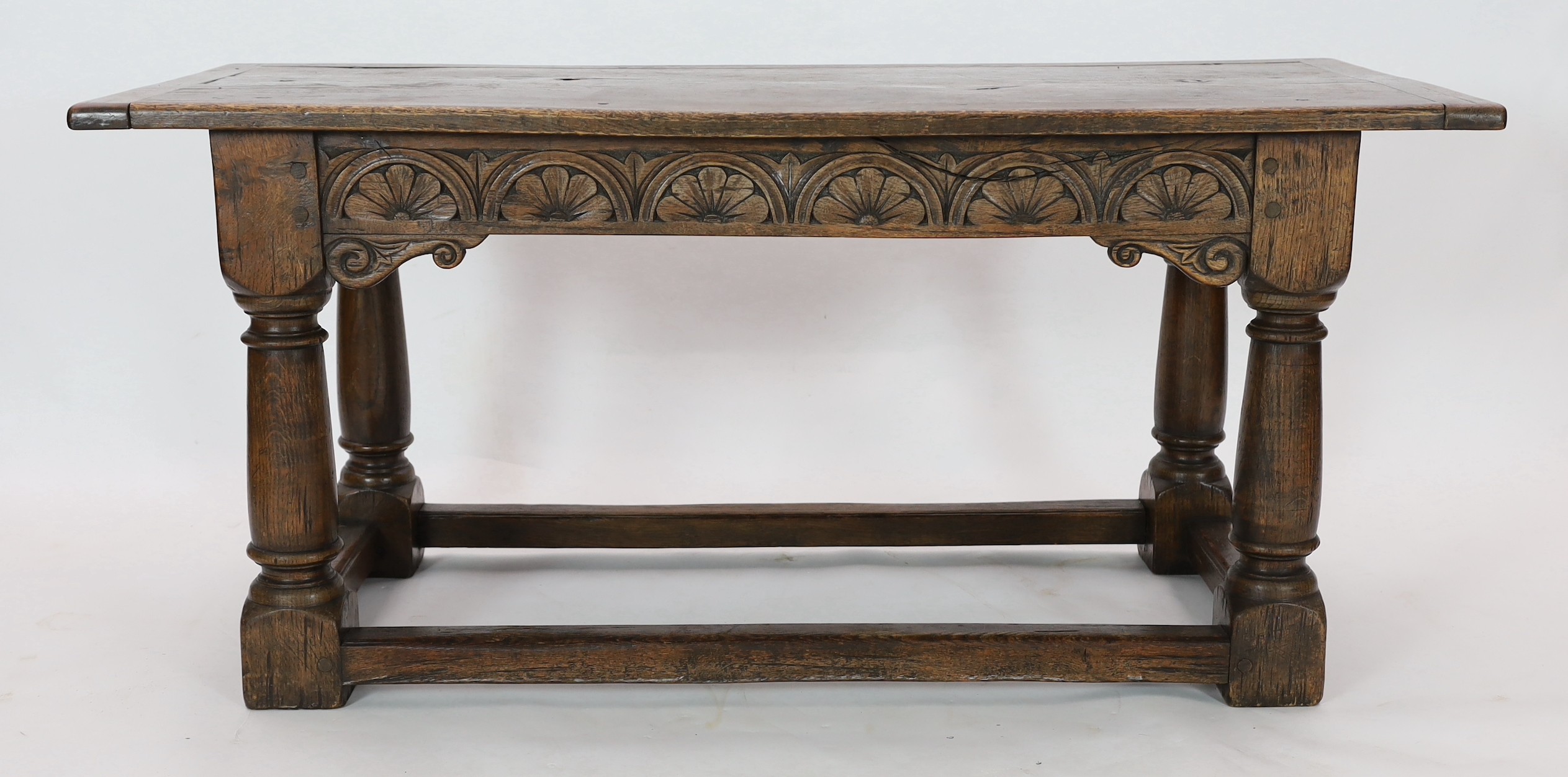 A 17th century style oak refectory table, width 167cm, depth 77cm, height 77cm